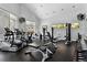 Well-equipped gym with various exercise machines, weights, and mounted televisions at 7931 W 55Th Ave # 105, Arvada, CO 80002