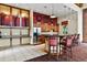 Modern kitchen area featuring stainless steel appliances, ample cabinet space, and an island with bar seating at 7931 W 55Th Ave # 105, Arvada, CO 80002