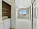 Bedroom features a laundry closet with a washer and dryer unit at 7931 W 55Th Ave # 105, Arvada, CO 80002