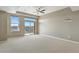 Living room featuring natural light and balcony access at 7931 W 55Th Ave # 105, Arvada, CO 80002