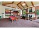 Elegant lounge area with a billiards table, bar, fireplace, and comfortable seating at 7931 W 55Th Ave # 105, Arvada, CO 80002