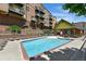 Inviting swimming pool surrounded by lounge chairs, perfect for relaxation and recreation at 7931 W 55Th Ave # 105, Arvada, CO 80002