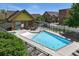 Outdoor swimming pool, with a clear view of neighborhood amenities, surrounded by community buildings at 7931 W 55Th Ave # 105, Arvada, CO 80002