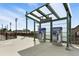 Public transportation station with ticket vending machines and a covered waiting area, promoting easy access at 7931 W 55Th Ave # 105, Arvada, CO 80002