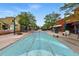 Charming street view with colorful street art, quaint shops, and inviting storefronts at 7931 W 55Th Ave # 105, Arvada, CO 80002