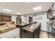 Basement bar with a wet bar, wood counters, stooled seating, and gun decor at 11769 Lovegrass Dr, Parker, CO 80138