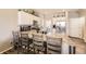 Modern kitchen with granite countertops, stainless steel appliances, and breakfast bar at 11769 Lovegrass Dr, Parker, CO 80138