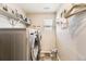 Efficient laundry room with modern washer and dryer units, maximizing space at 11769 Lovegrass Dr, Parker, CO 80138