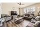 Comfortable living room featuring large window, neutral tones, and cozy seating at 11769 Lovegrass Dr, Parker, CO 80138