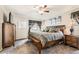 Spacious bedroom with a large bed, complemented by matching nightstands and ample natural light at 11769 Lovegrass Dr, Parker, CO 80138