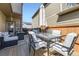 Back patio has a seating area, dining table with umbrella, and string lights at 11769 Lovegrass Dr, Parker, CO 80138
