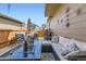 Outdoor patio with comfortable seating and a stylish glass fire pit table at 11769 Lovegrass Dr, Parker, CO 80138