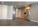 Basement kitchenette area with stainless steel refrigerator and a gray concrete floor at 3725 S Nepal St, Aurora, CO 80013