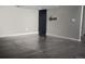 Open basement space with a dark stained concrete floor and light gray walls at 3725 S Nepal St, Aurora, CO 80013