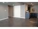 Basement area featuring a kitchenette space, concrete floors, and access to additional storage at 3725 S Nepal St, Aurora, CO 80013