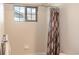 Bathroom with tile walls, shower with patterned curtain and natural light at 3725 S Nepal St, Aurora, CO 80013