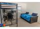 Bedroom with a lofted bed above, sleeper sofa, desk, and lots of room to study and relax at 3725 S Nepal St, Aurora, CO 80013