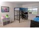 bedroom features a loft bed with a desk and a secondary sleeping space at 3725 S Nepal St, Aurora, CO 80013