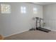 Bonus room with neutral carpet, ample natural light, and exercise equipment at 3725 S Nepal St, Aurora, CO 80013