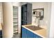 Basement kitchenette space includes a sink and provides access to storage at 3725 S Nepal St, Aurora, CO 80013