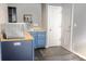 Basement kitchenette area features a sink, dishwasher and an exterior door at 3725 S Nepal St, Aurora, CO 80013