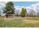 Fenced backyard with a pool and mature trees enhances this well-maintained home at 1324 State Highway 66, Longmont, CO 80504