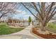 View of the backyard with a pool, pool house, and mature landscaping at 1324 State Highway 66, Longmont, CO 80504