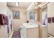 Cozy bathroom with a mirrored cabinet, shower with a patterned curtain, providing a private and functional space at 1324 State Highway 66, Longmont, CO 80504