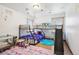 Playful ' bedroom with a fun bunk bed featuring a slide and creative decor, fostering an imaginative and vibrant atmosphere at 1324 State Highway 66, Longmont, CO 80504