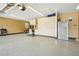 Organized garage with epoxy flooring, built-in storage, and a workbench, ready for projects at 1324 State Highway 66, Longmont, CO 80504