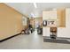 Large garage featuring an epoxy floor, built-in cabinets, workbench, and storage for equipment at 1324 State Highway 66, Longmont, CO 80504