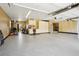 Well-organized garage with epoxy floor, workspace, ample storage cabinets, and a motorcycle at 1324 State Highway 66, Longmont, CO 80504
