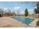 View of the private in-ground pool with a slide and a pool house nearby at 1324 State Highway 66, Longmont, CO 80504