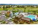 Aerial view of community amenities featuring pools, club house, water slides, and pool side furniture at 3548 Swabuck Pl, Castle Rock, CO 80109