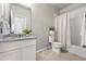 Bathroom with a granite countertop vanity, decorative plants, tile floor and shower/tub combination at 3548 Swabuck Pl, Castle Rock, CO 80109