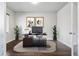 Dedicated home office space with modern decor, wood floors, and ample natural light at 3548 Swabuck Pl, Castle Rock, CO 80109