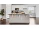 Kitchen island featuring a granite countertop, ample space for food prep, and a stainless-steel microwave at 3548 Swabuck Pl, Castle Rock, CO 80109