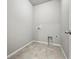 Empty laundry room with hookups and tile floors at 3548 Swabuck Pl, Castle Rock, CO 80109