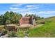 Beautiful Butterfield Crossing Park entrance with natural stone and colorful landscaping for a welcoming experience at 3548 Swabuck Pl, Castle Rock, CO 80109