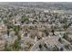 Expansive aerial view showcases the serene neighborhood with tree-lined streets and diverse homes at 6918 E Easter Pl, Centennial, CO 80112