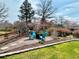 Charming backyard fire pit area with Adirondack chairs, perfect for outdoor relaxation at 6918 E Easter Pl, Centennial, CO 80112