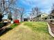 Spacious backyard featuring mature trees, a lush lawn, and various recreational features at 6918 E Easter Pl, Centennial, CO 80112