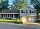Charming two-story home features a well-manicured front yard and an attached two-car garage at 6918 E Easter Pl, Centennial, CO 80112
