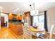 Updated kitchen boasts custom cabinets, stainless appliances, granite counters, and hardwood floors, breakfast nook at 6918 E Easter Pl, Centennial, CO 80112