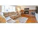 Inviting living room with a brick fireplace, large windows, and comfortable seating at 6918 E Easter Pl, Centennial, CO 80112