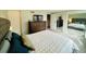 A comfortable main bedroom with a dresser, television, and carpeted floor at 6918 E Easter Pl, Centennial, CO 80112