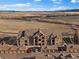 Scenic aerial shot highlighting condo building with garage parking and open field views at 9962 W Victoria Pl # 106, Littleton, CO 80127
