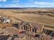 Aerial shot displays condo building with garage parking and a beautiful lake backdrop at 9962 W Victoria Pl # 106, Littleton, CO 80127