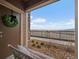Serene balcony area with seating, offering scenic views of the surrounding landscape and horizon at 9962 W Victoria Pl # 106, Littleton, CO 80127