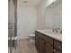 Spacious bathroom featuring a glass-enclosed shower and a modern vanity with a sink at 9962 W Victoria Pl # 106, Littleton, CO 80127